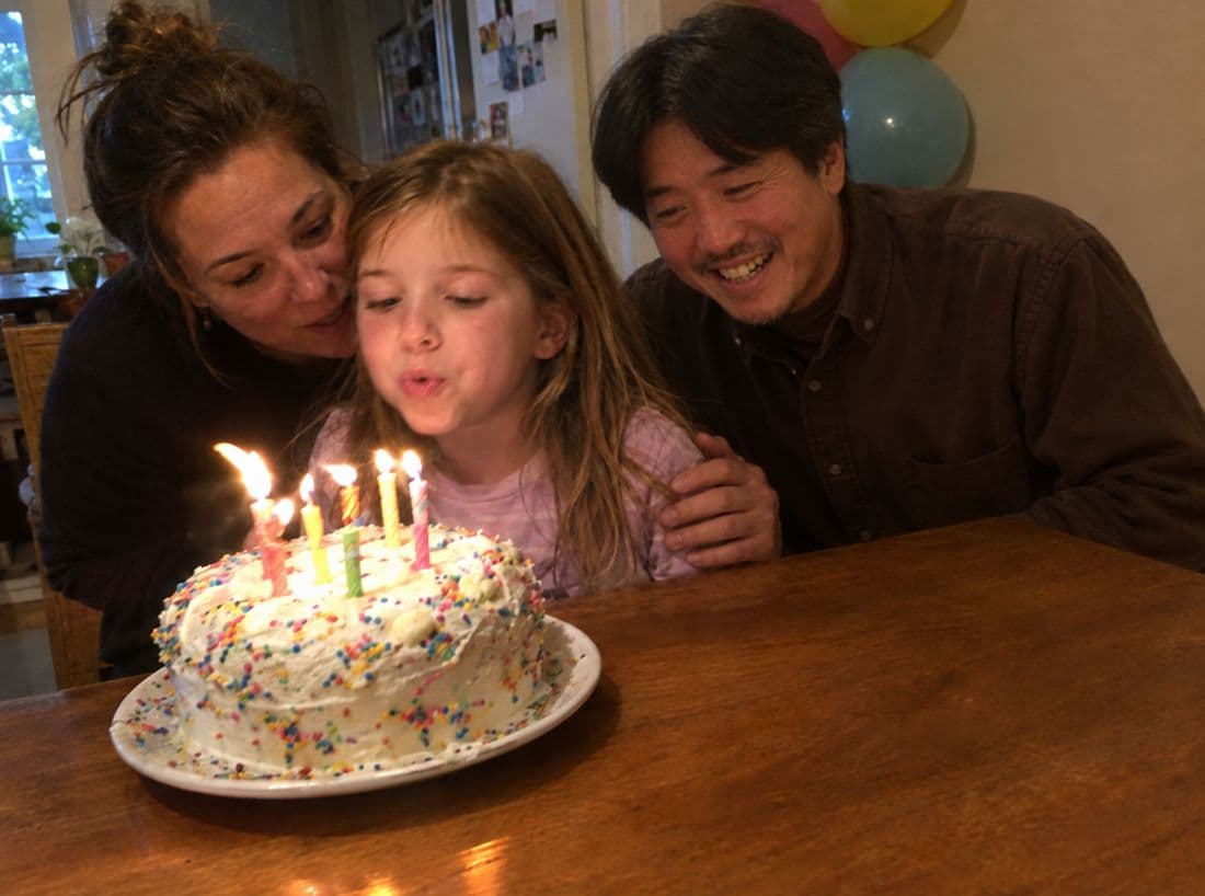The birthday photo with her father beside her